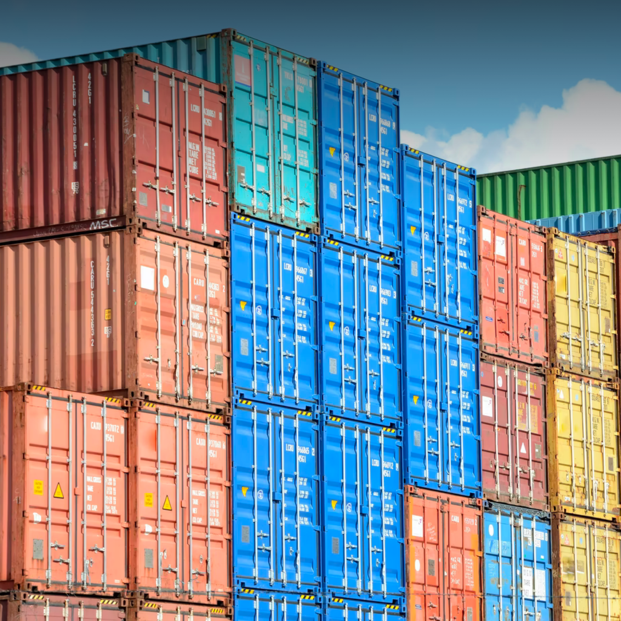 Shipping containers stacked at a port.